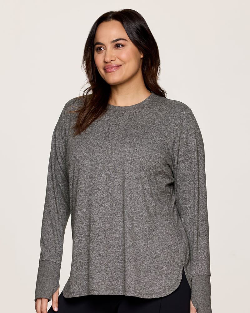 Side of a model wearing a size 1X Plus Studio Super Soft Tunic Tee in Charcoal by RBX Active. | dia_product_style_image_id:341673